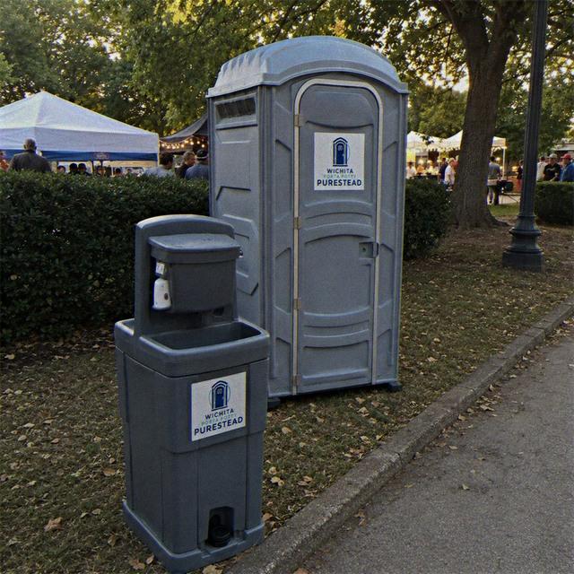 Hand wash station beside porta potty Wichita